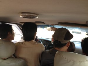 this is inside the taxi to Battambang. The guy second from left is driving. They managed to fit 4adults and a child across the front seat.....